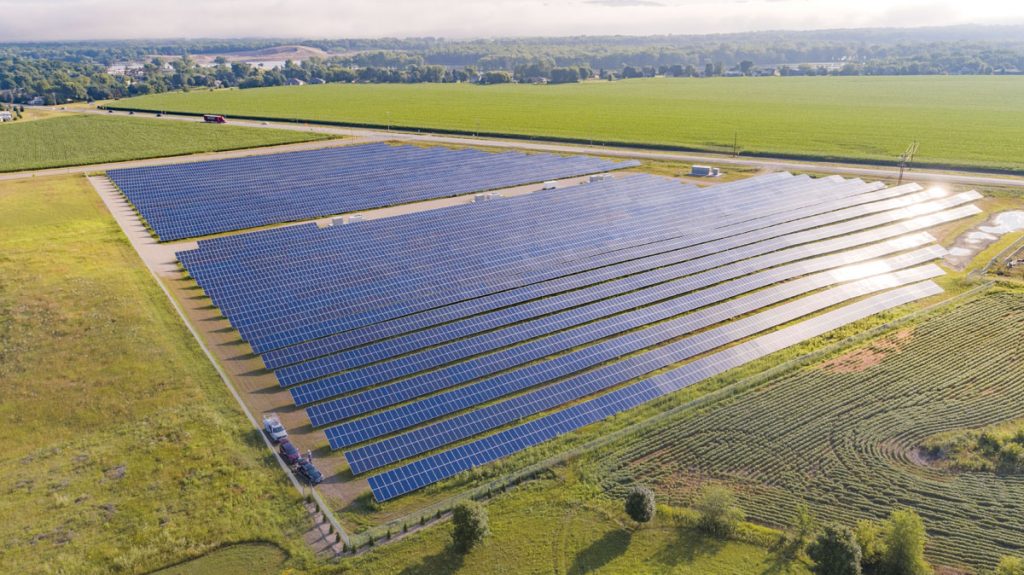 A Minnesota community solar farm in a green grass field