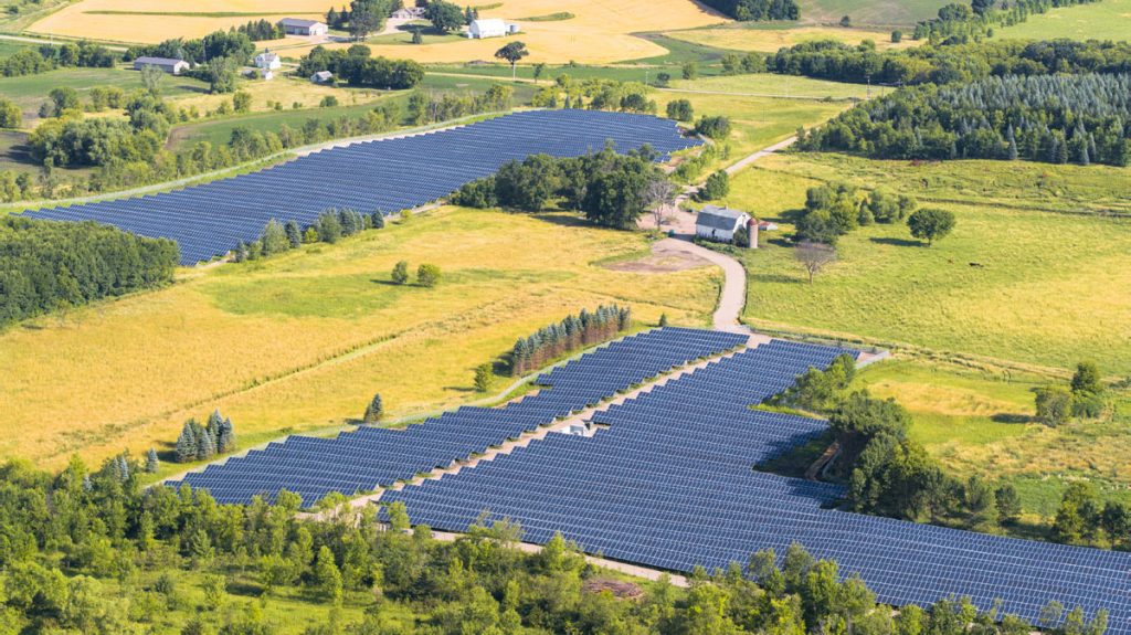 Two Minnesota community solar farms in a green field