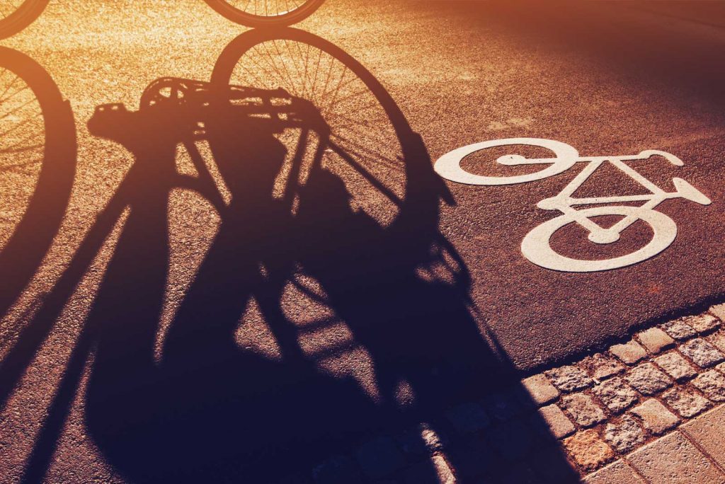 Shadow of a person riding a bike