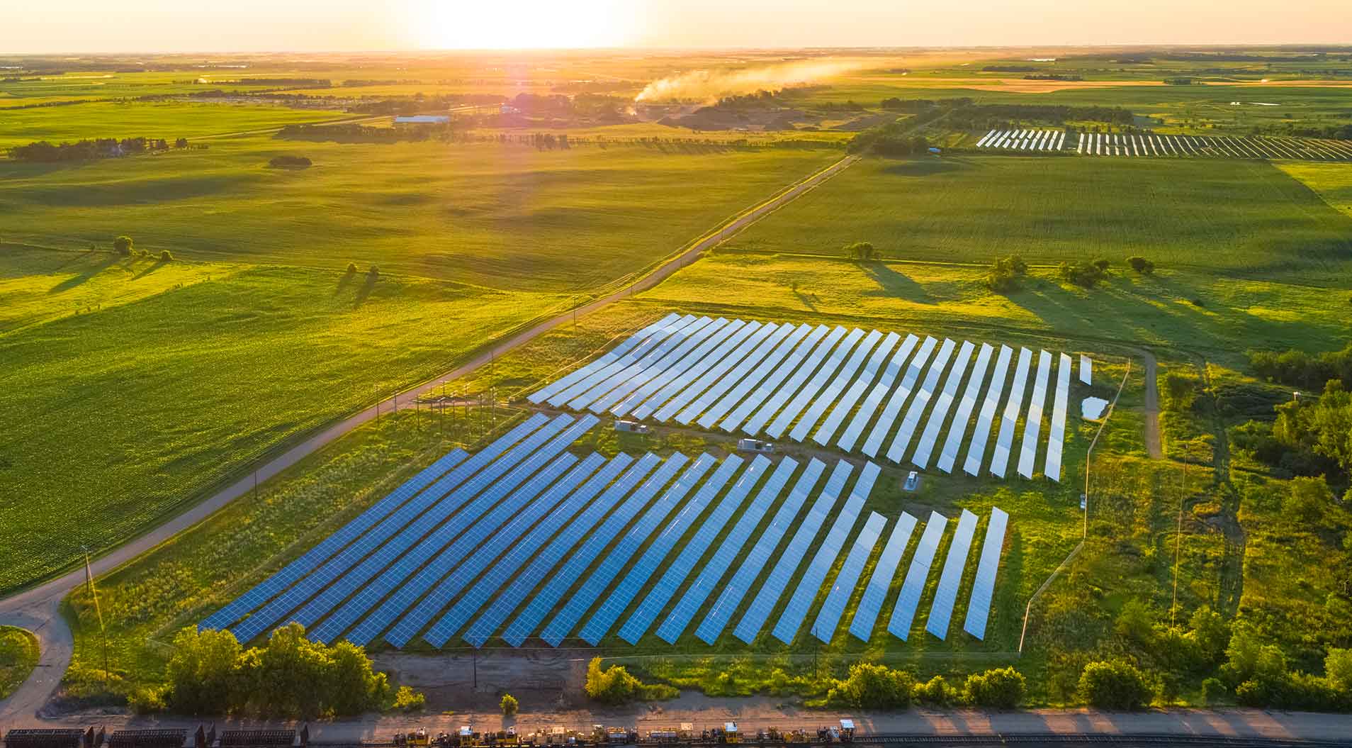Aerial view of solar panels in a solar farm field
