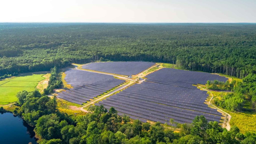 Aerial view of solar panels in a solar farm field