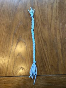 nine pieces of blue string braided together