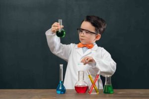 Young boy using a chemistry set