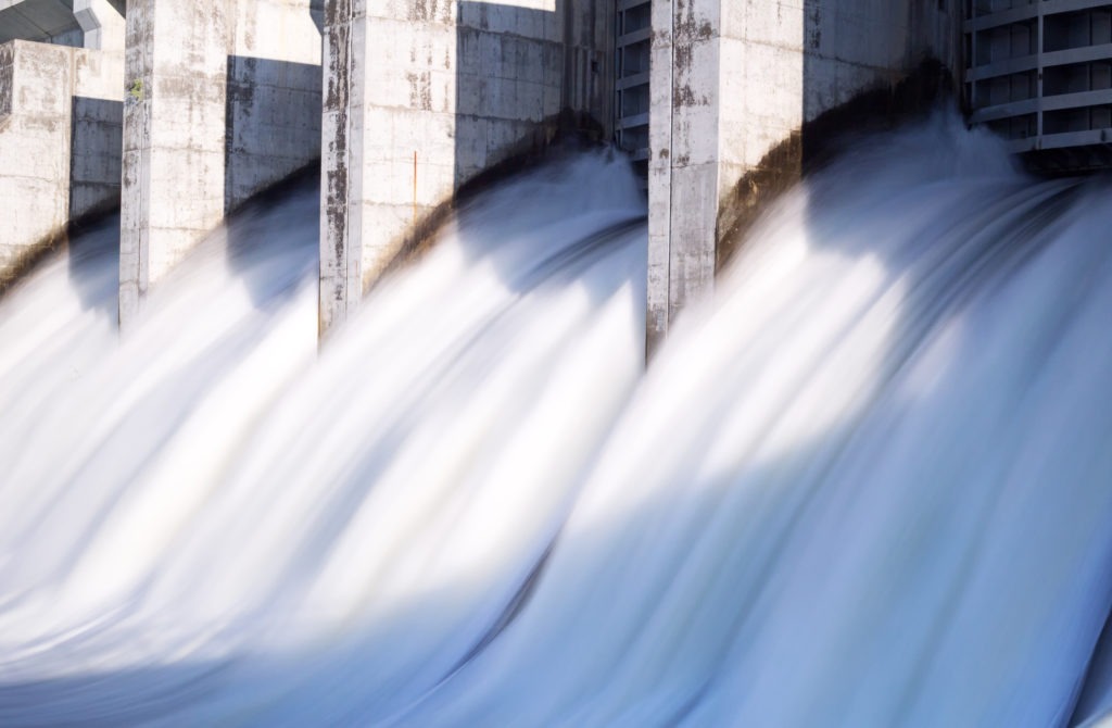 water rushing out of hydro dam