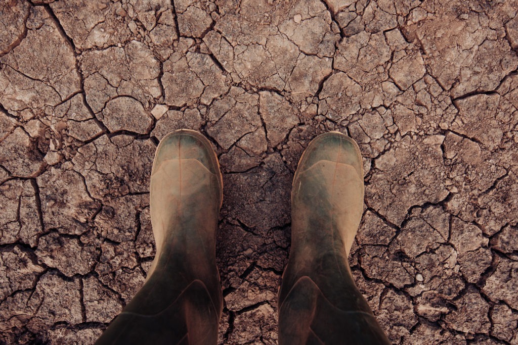 rubber boots standing on dry ground