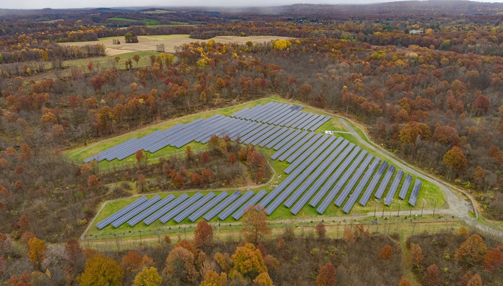 Aerial view of solar panels in a solar farm field