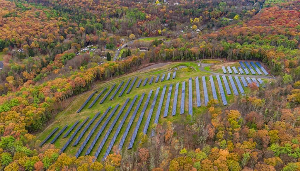 Aerial view of solar panels in a solar farm field