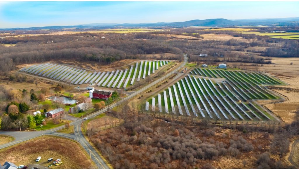 Aerial view of solar panels in a solar farm field