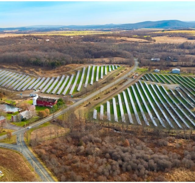 Aerial view of solar panels in a solar farm field
