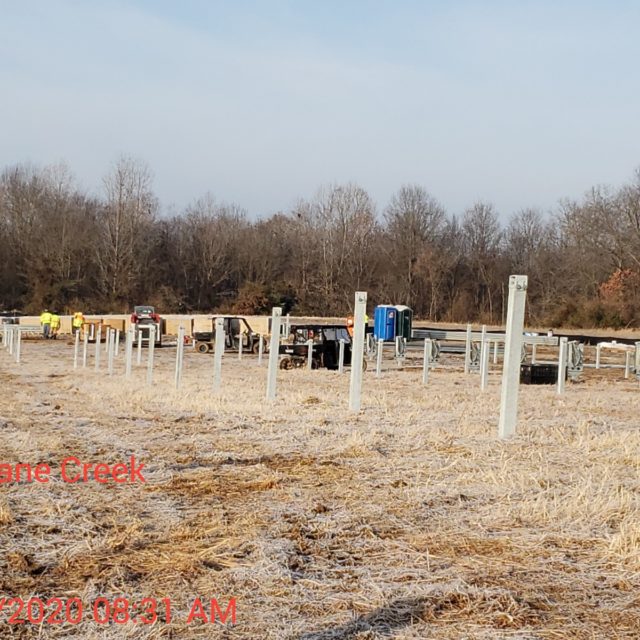 field with poles in the ground