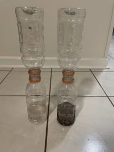 two bottles glued to other bottles