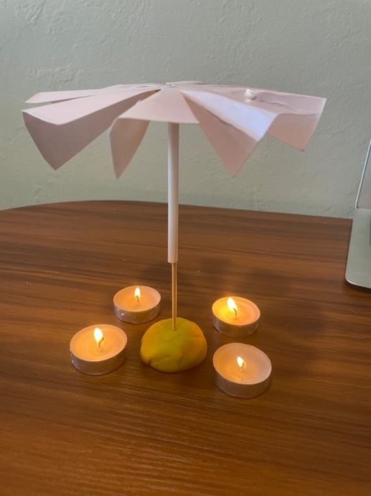 candles with paper carousel