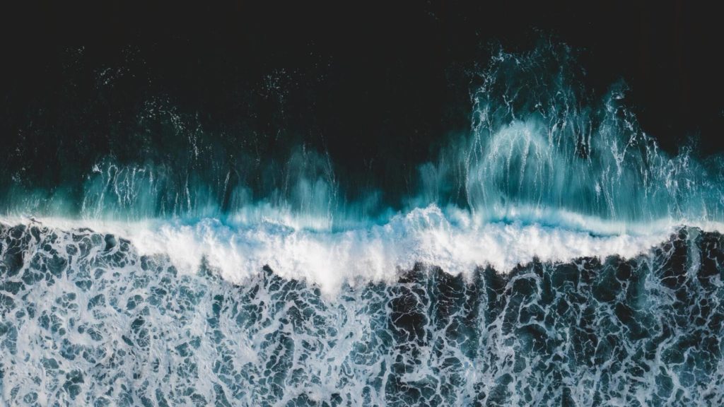 Ocean wave breaking on the beach